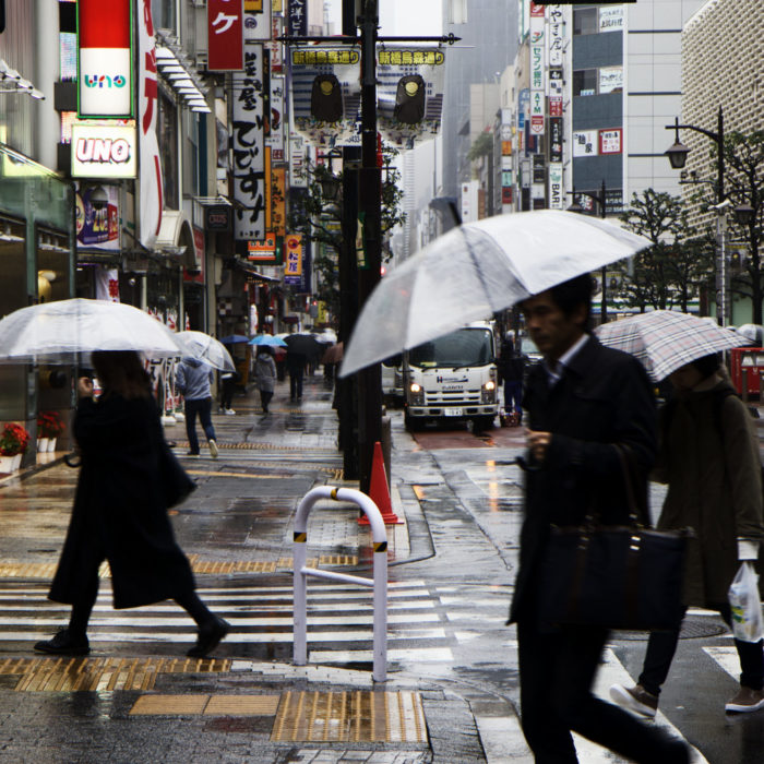 A busy street scene during a rainstorm, Tokyo.